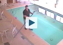 Man about to fall into swimming pool