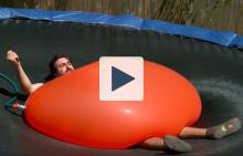 Dan under a 6ft water balloon
