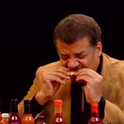 Neil deGrasse Tyson eating a hot wing