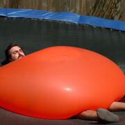 Dan under a 6ft water balloon