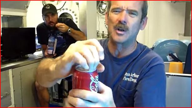 Hadfield opening a soda