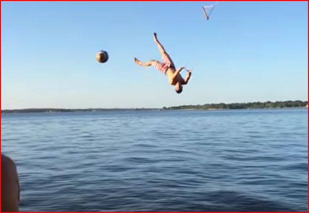 Man catching a ball mid-air