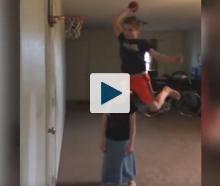 Boy jumping over girl