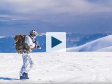 Military soldier walking in the snow