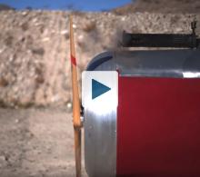 Bullet being fired through an airplane propeller