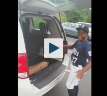 Boy opening minivan hatch