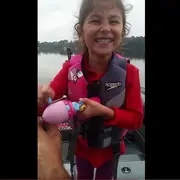 Avery reeling in her fish