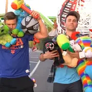 Mark Rober and Matt Winaker with carnival prizes
