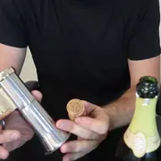 Taras holding a champagne opener