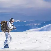 Military soldier walking in the snow