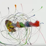 Spinning drill bit covered in paint
