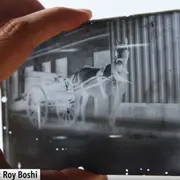 Hand holding a negative 