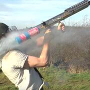 Man shooting fireworks from a homemade launcher