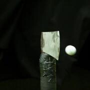 Golf ball and axe