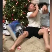 Man being attacked by cat