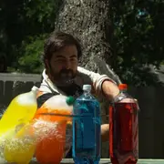 Dan cutting plastic bottles with a katana sword