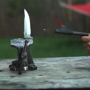 Pellet being fired at a knife blade