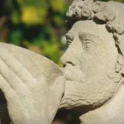 Roman statue drinking from bowl