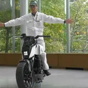 Man standing on a motorcycle