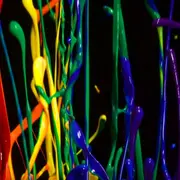 Rainbow colored paint in mid-air