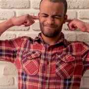 Man with ears plugged by his fingers