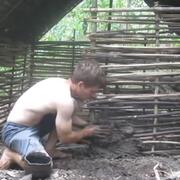 Man building hut