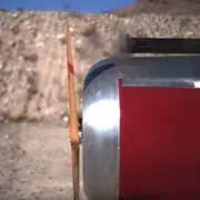 Bullet being fired through an airplane propeller